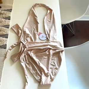 PQ one piece swim in color shell. Size M. NWT